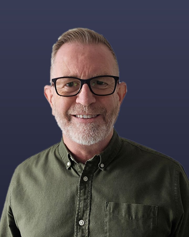 Steve Wood, smiling, in a green shirt